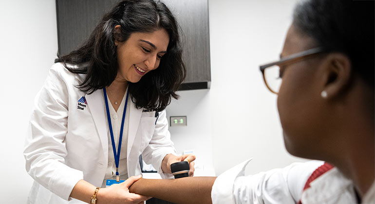 doctor examining patient